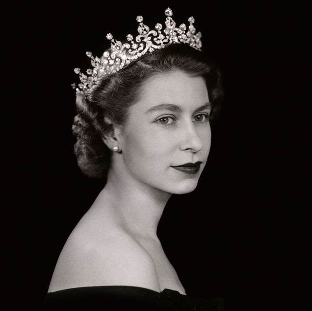 Black and white portrait of a woman wearing a sparkling diamond tiara and pearl earrings