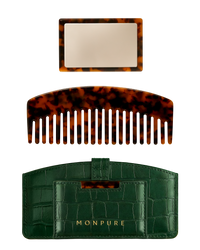 Luxury travel set with tortoiseshell comb and mirror, housed in green crocodile-effect case