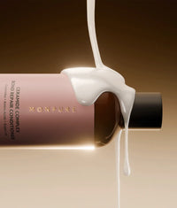 Monpure Ceramide Complex Bond Repair Conditioner bottle with creamy conditioner pouring over it