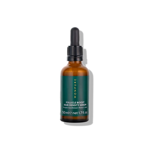 Amber glass bottle with green label containing Follicle Boost Hair Density Serum with dropper cap