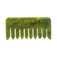 Small green jade comb with wide teeth and gold Monpure London branding