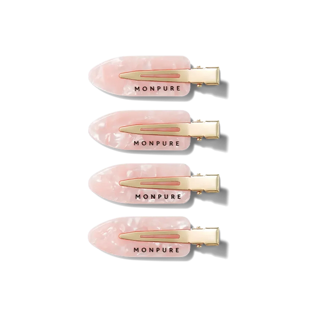 Set of four pink marbled no-crease hair clips with gold metal clasps and Monpure branding