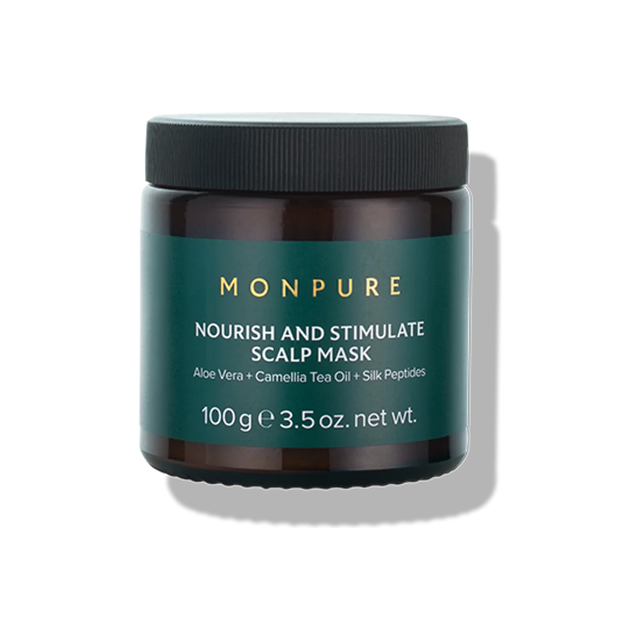 Dark brown jar with black lid containing Monpure Nourish and Stimulate Scalp Mask with aloe vera and camellia tea oil