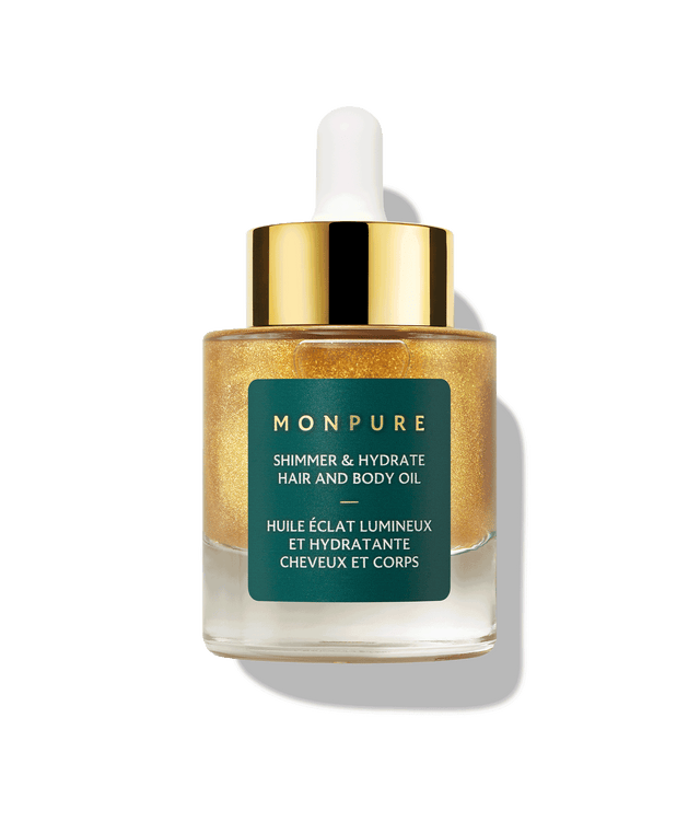 Small glass bottle of golden shimmer and hydrate hair and body oil with white dropper and gold cap