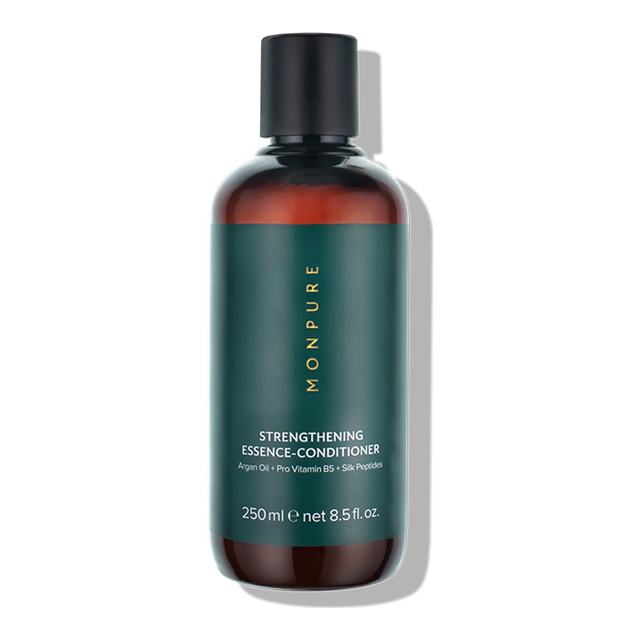 250ml amber plastic bottle of Monpure Strengthening Essence-Conditioner with green label and black cap