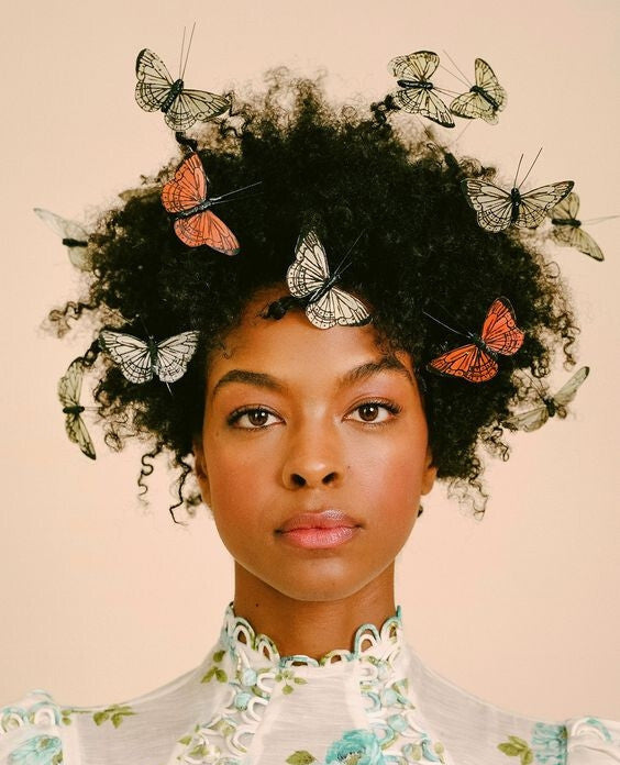 stress causes an itchy scalp - women with butterflies in her hair