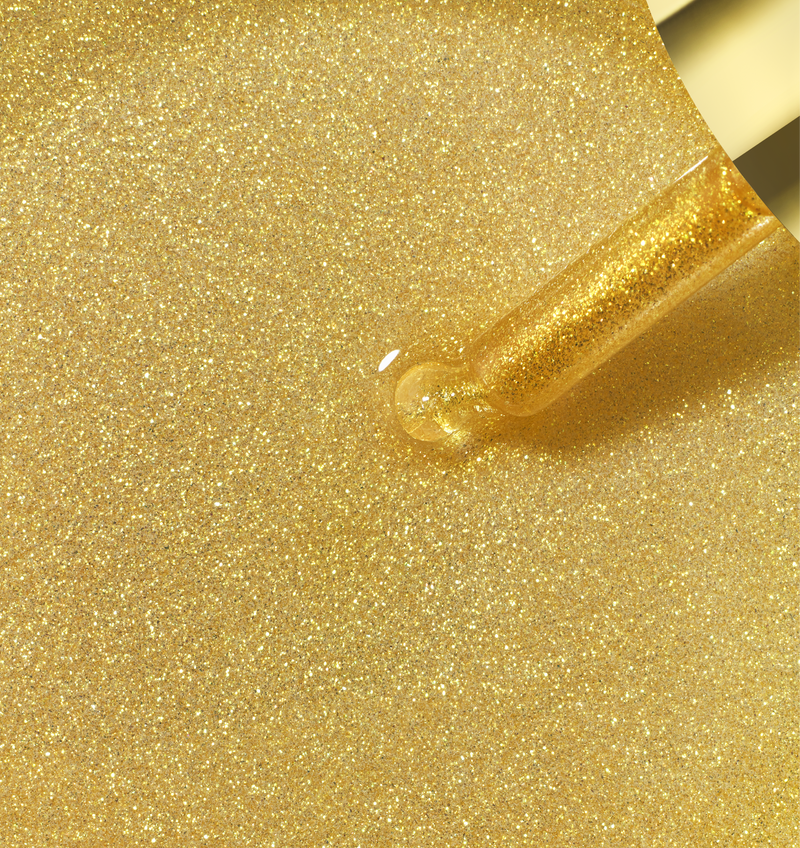 Golden shimmer and hydrate hair and body oil with glitter particles on applicator dropper