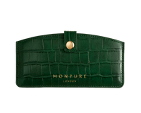 Dark green crocodile-effect leather travel case with gold button and Monpure London branding