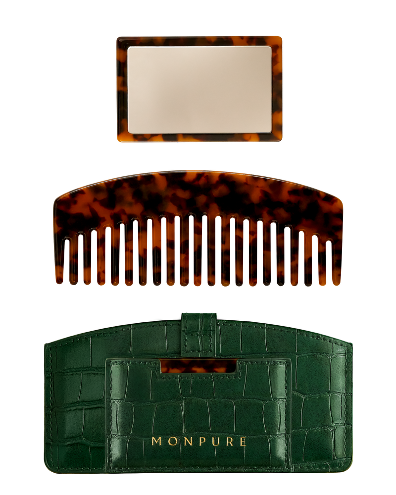 Luxury travel set with tortoiseshell comb and mirror, housed in green crocodile-effect case