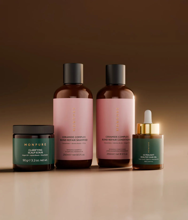 Set of hair care products including clarifying scalp scrub, ceramide complex shampoo and conditioner, and ultralight healthy hair oil