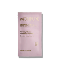Monpure Ceramide Complex Bond Repair Shampoo sachet in soft pink with gold text, 7ml size