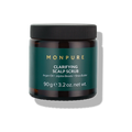 Brown jar of Monpure clarifying scalp scrub with green label and black lid, 90g