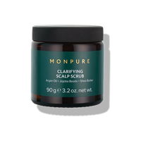 Brown jar of Monpure clarifying scalp scrub with green label and black lid, 90g