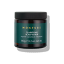 Brown jar of Monpure Clarifying Scalp Scrub with green label and black lid, 90g