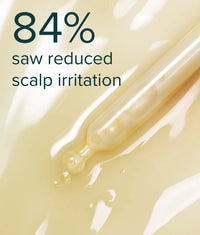Clear yellowish scalp serum with dropper highlighting 84% reduction in scalp irritation