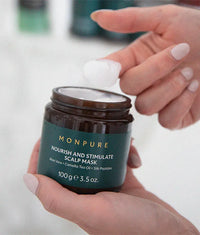 Brown jar of Monpure Nourish and Stimulate Scalp Mask with white cream and green label