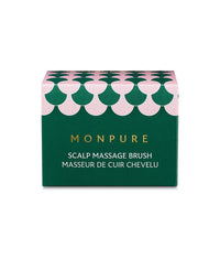 Green and pink patterned box packaging for Monpure scalp massage brush
