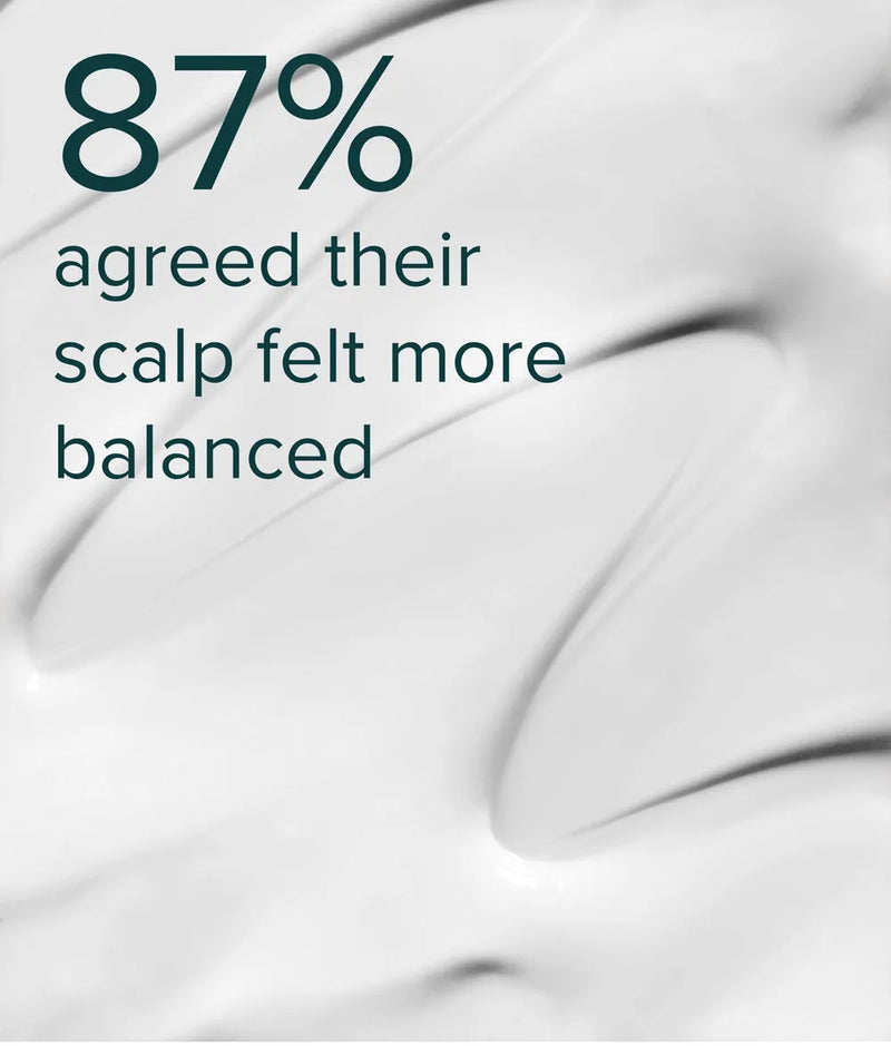 Smooth white creamy texture of Strengthening Essence-Conditioner for balanced scalp