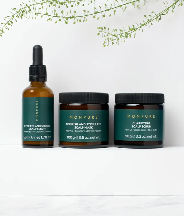 Monpure Triple-Hydration Hit Regime with scalp serum, mask, and scrub in amber and green containers