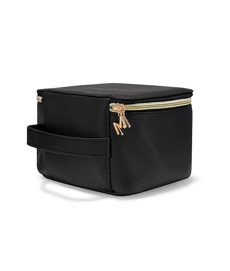 Black vegan leather beauty case with gold zipper and side handle, compact square shape