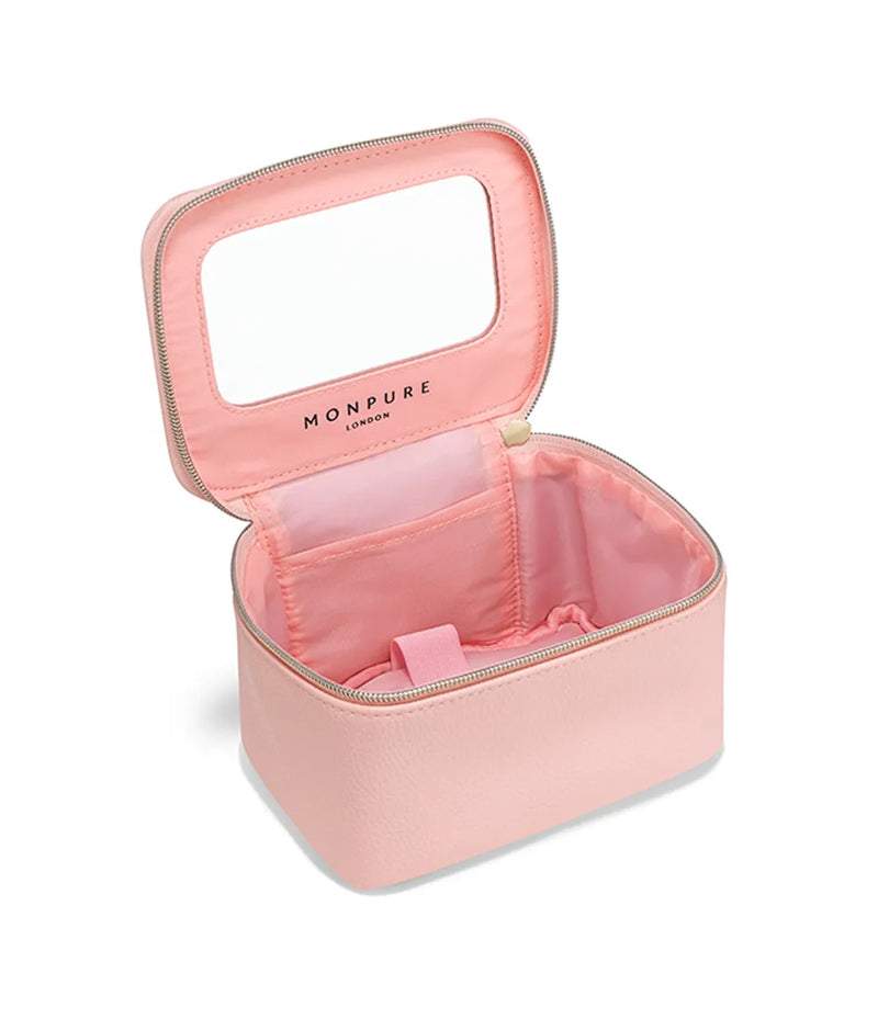 Pink vegan leather beauty case with zipper, interior pockets, and built-in mirror