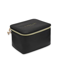 Black vegan leather beauty case with gold zipper and embossed brand logo on top