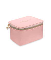 Pink vegan leather beauty case with gold zipper and embossed logo on top